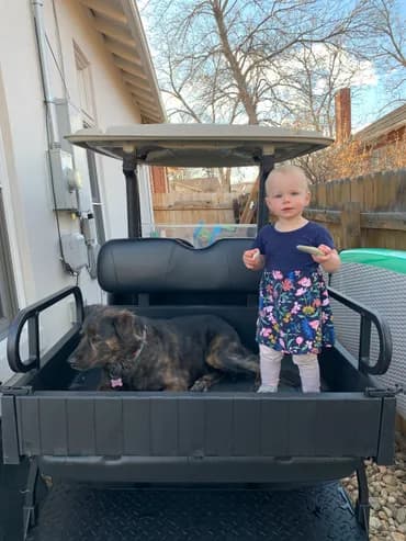 Family enjoying a golf cart